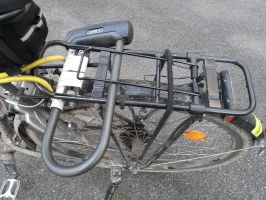 Homemade U-lock holder on a bicycle rack